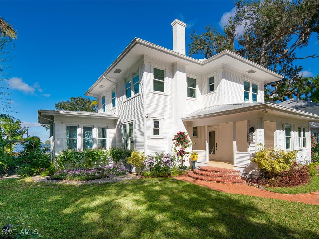 101 Fairview Avenue Fort Myers, FL 33905 - Photo 2 of 34 a front view of a house with a yard