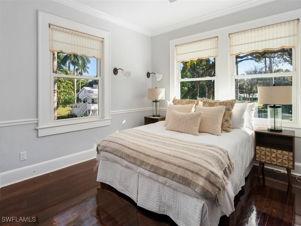 101 Fairview Avenue Fort Myers, FL 33905 - Photo 21 of 34 a bed sitting in a bedroom next to a window