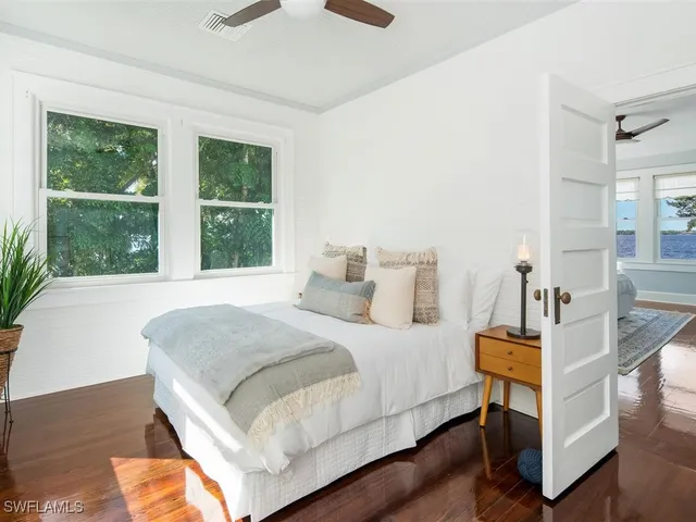 a bedroom with a bed and window