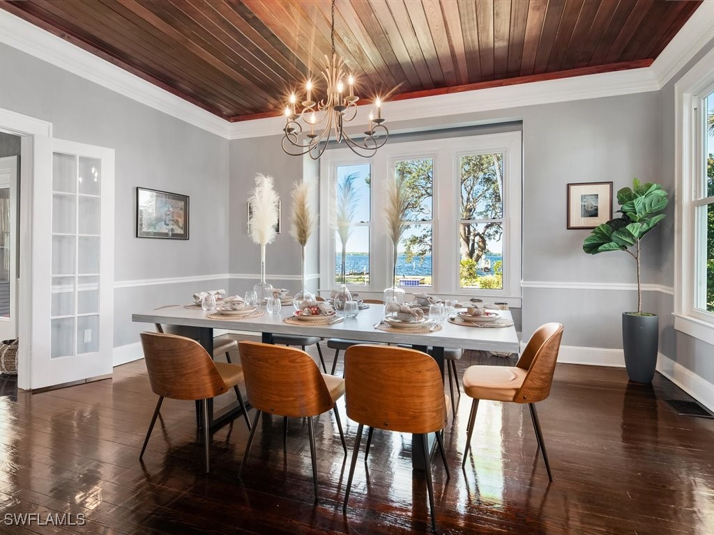 101 Fairview Avenue Fort Myers, FL 33905 - Photo 10 of 34 a view of a dining room with furniture wooden floor and chandelier