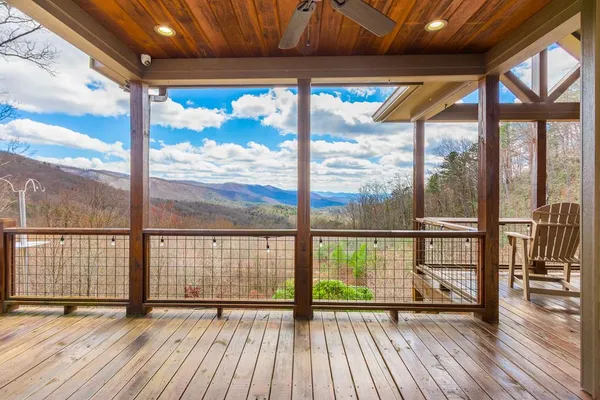 a front view of a house with yard and green space