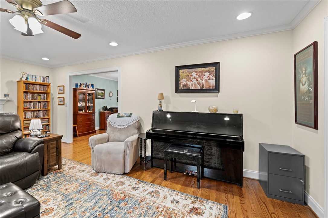 2004 Cardinal Park Drive Anderson, SC 29621 - Photo 11 of 40 Gleaming hardwood floors and classic crown molding accent this comfortable, versatile living space.