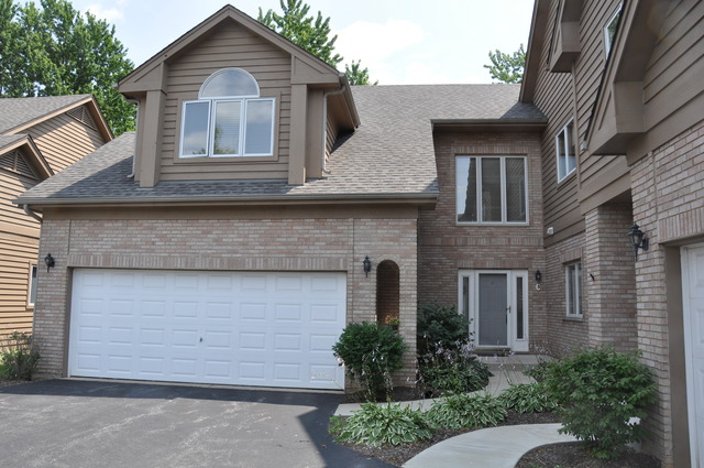 1905 Plainfield Road, Unit C Downers Grove, IL 60516 - Photo 20 of 20 a front view of a house with a yard and garage