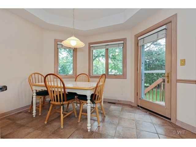 1905 Plainfield Road, Unit C Downers Grove, IL 60516 - Photo 4 of 20 a view of a dining room with furniture window and outside view