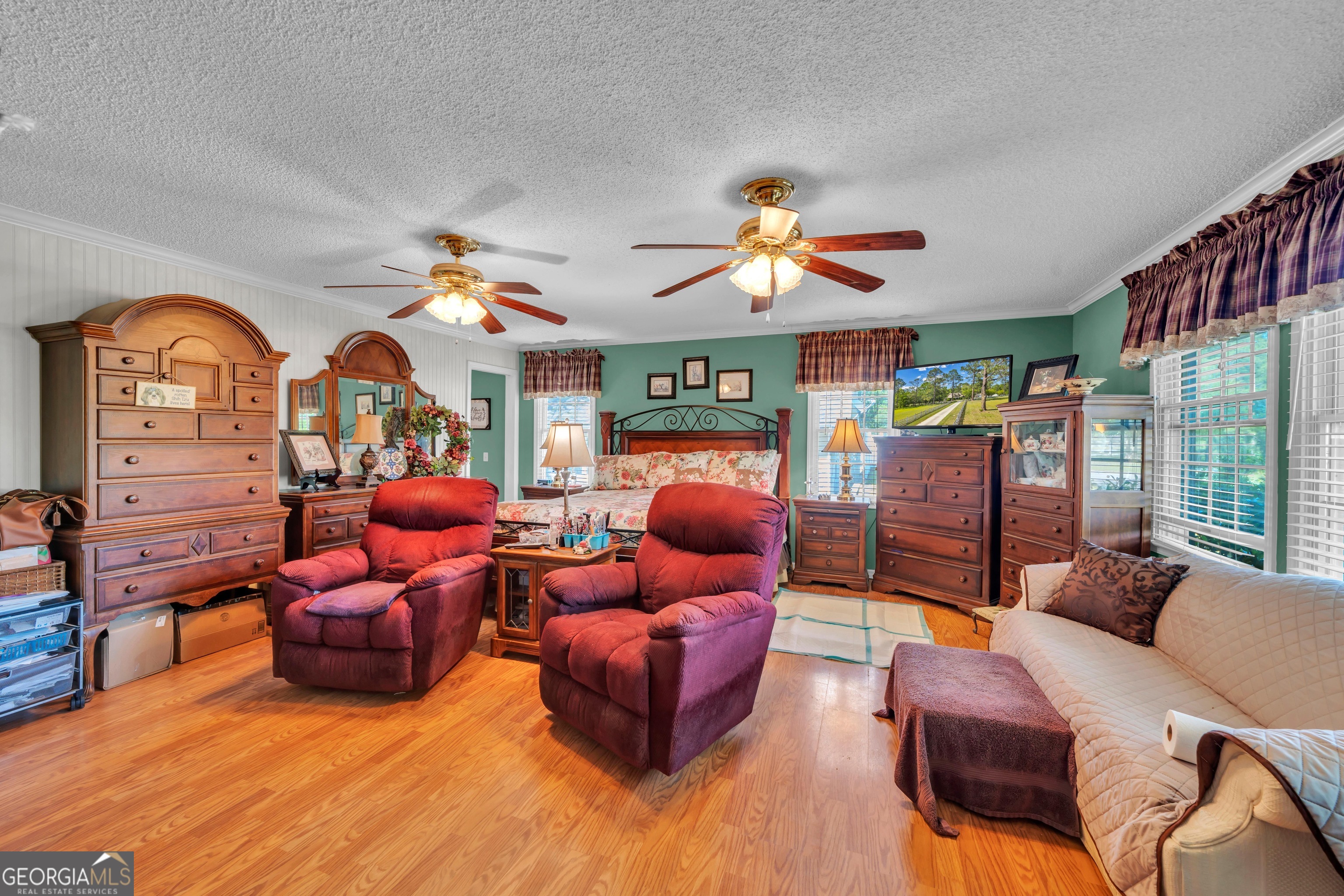 87 Georgia Avenue Adrian, GA 31002 - Photo 46 of 74 a living room with furniture a ceiling fan and a window