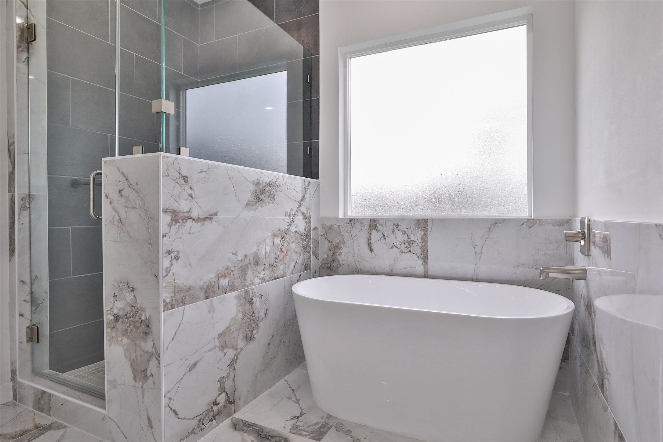 9349 Lavender Street Houston, TX 77016 - Photo 17 of 29 a white bath tub sitting in a bathroom