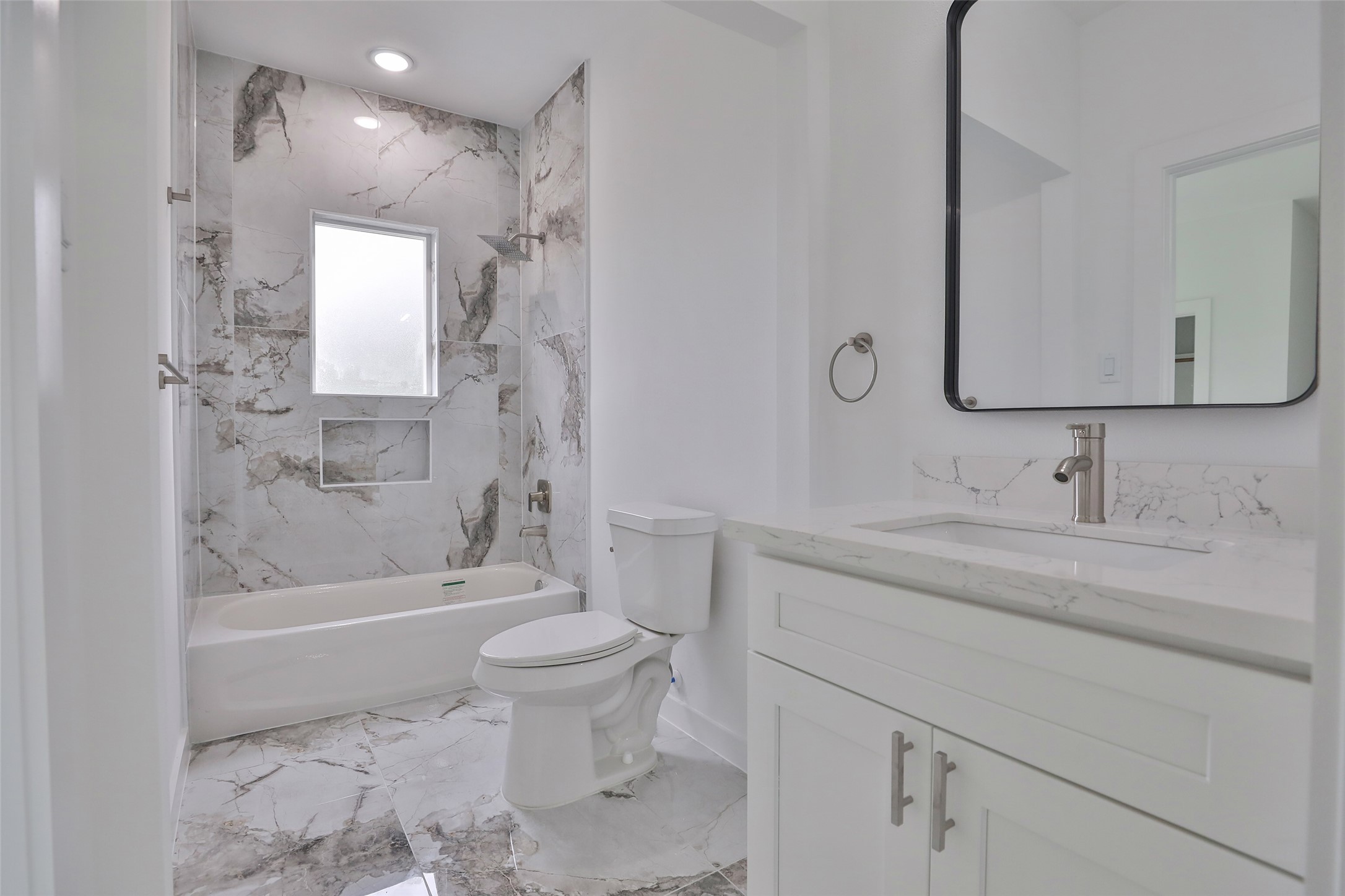 9349 Lavender Street Houston, TX 77016 - Photo 21 of 29 a bathroom with a sink a toilet and shower