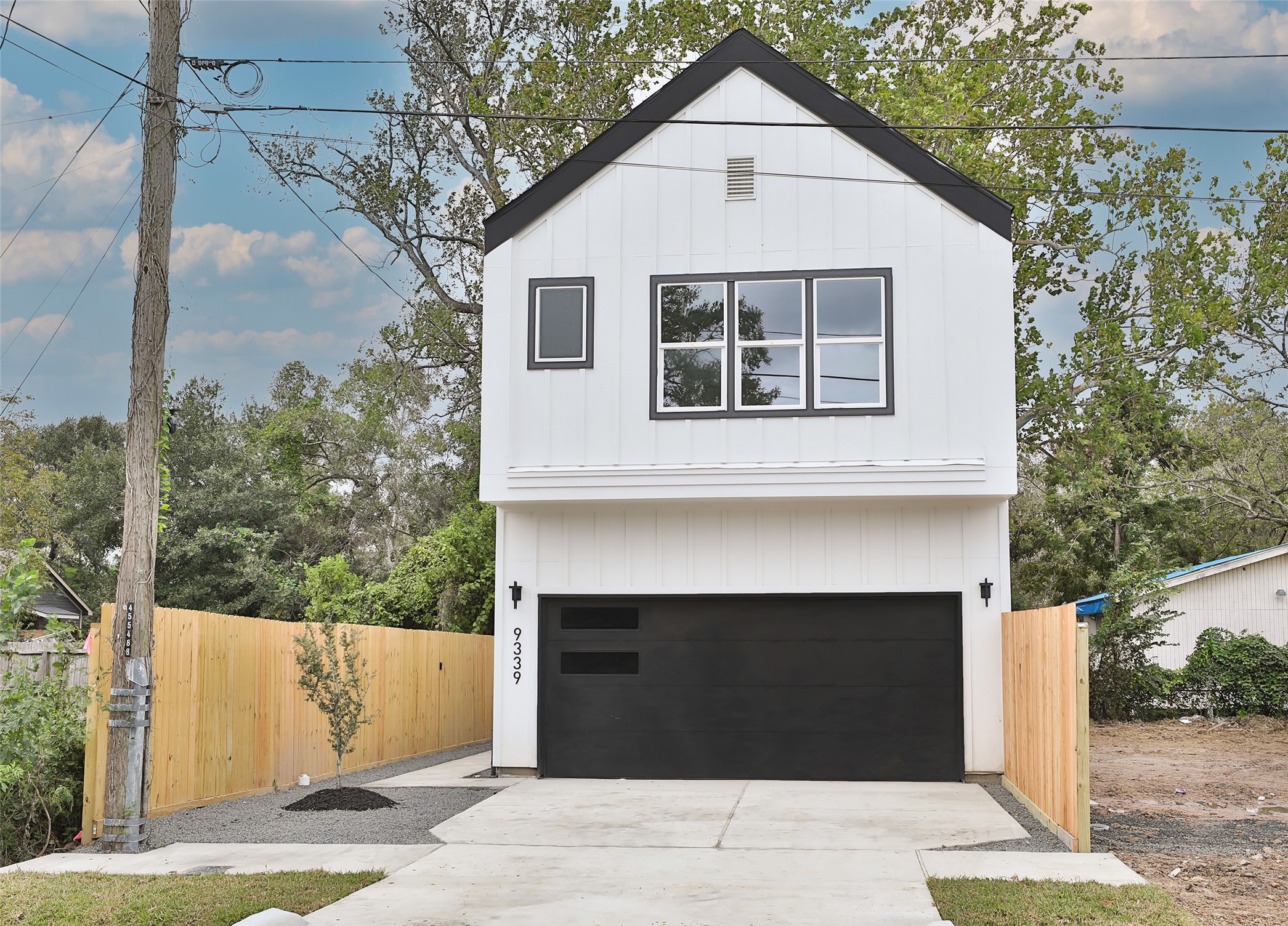 9349 Lavender Street Houston, TX 77016 - Photo 28 of 29 a view of a white house with a large windows