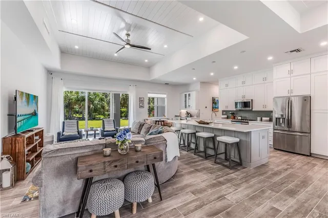 a large kitchen with a table and chairs