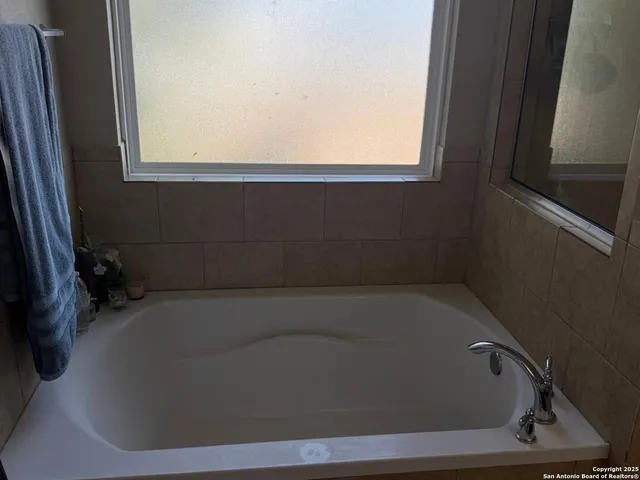 a close up of a bathtub in a bathroom