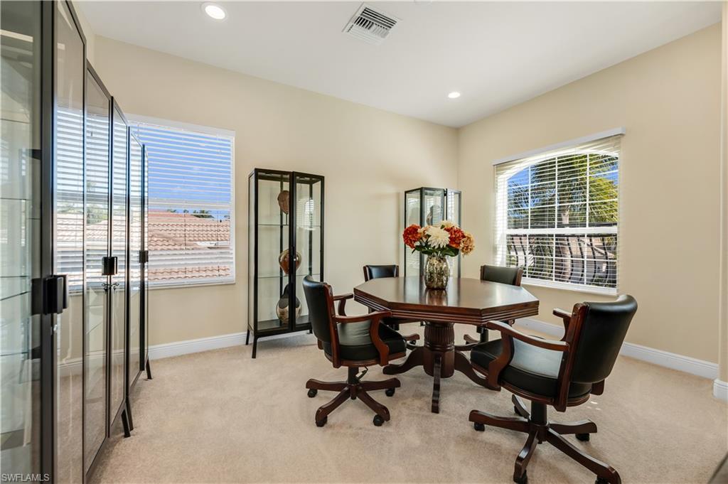 7810 Martino Circle Naples, FL 34112 - Photo 11 of 23 a view of a workspace with furniture and a window