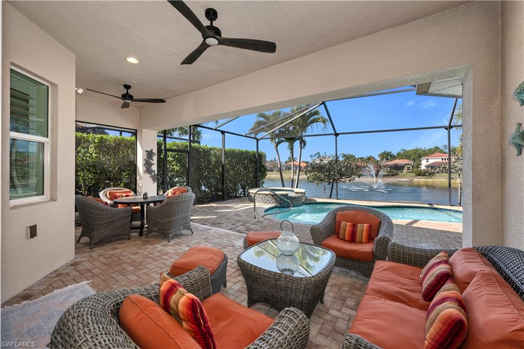7810 Martino Circle Naples, FL 34112 - Photo 18 of 23 a outdoor living space with furniture and a rug