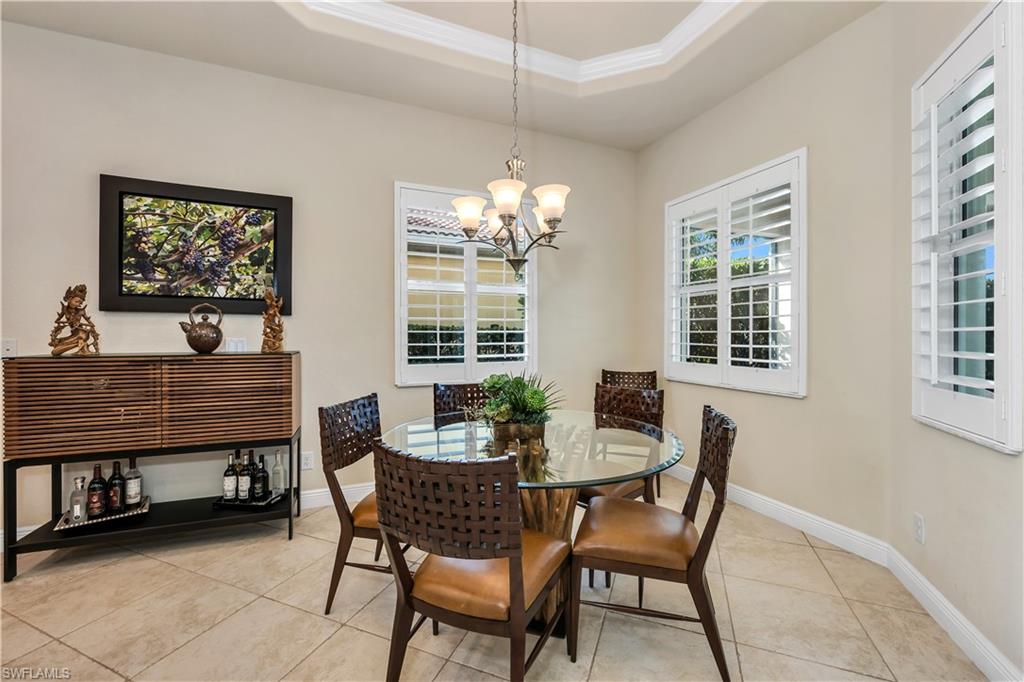 7810 Martino Circle Naples, FL 34112 - Photo 7 of 23 a dining room with furniture and window