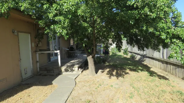 a house view with a backyard space