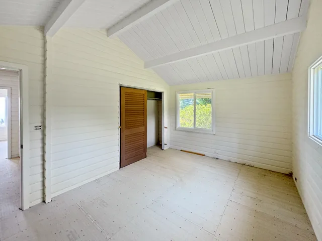 a view of a patio with table and chairs