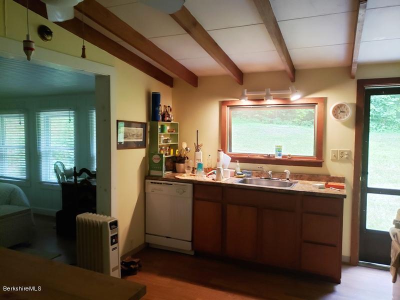 143 Sandisfield Road Monterey, MA 01245 - Photo 7 of 16 a kitchen with sink and view of living room