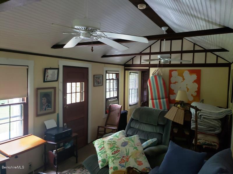 143 Sandisfield Road Monterey, MA 01245 - Photo 10 of 16 a living room with furniture and a chandelier
