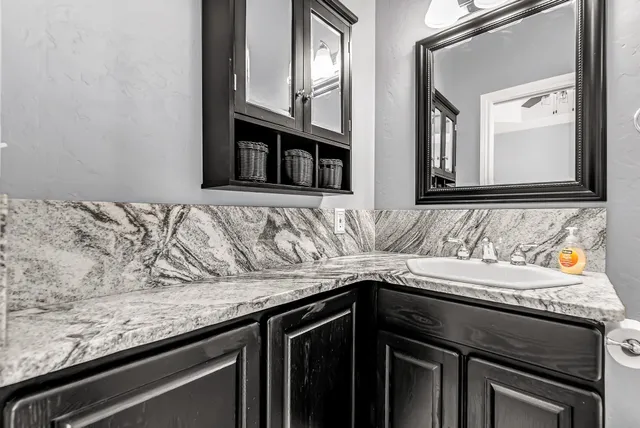 a kitchen with a sink and a stove