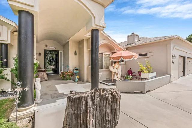 a view of a patio with couches and potted plants