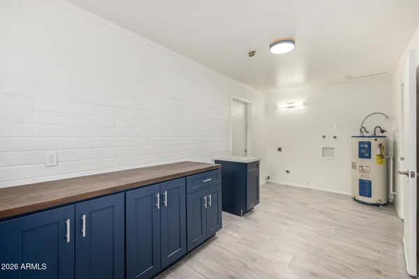 a kitchen with a refrigerator and a sink