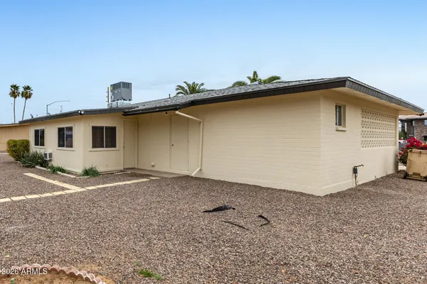 a house with trees in the background