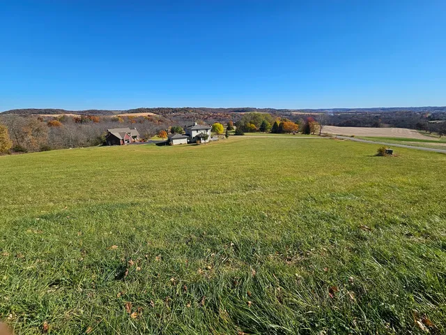 a view of multiple houses with a street