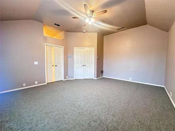 a spacious bathroom with double vanity sink a mirror and a shower