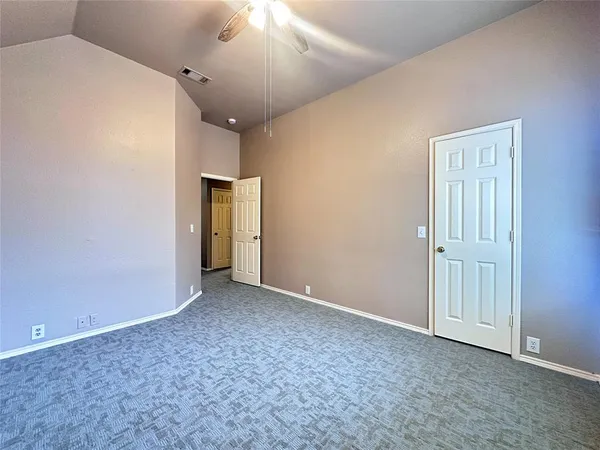 an empty room with a empty space and windows