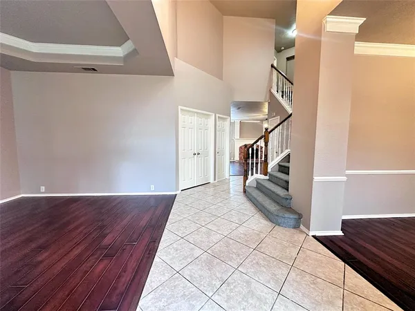 a view of entryway and hall with wooden floor