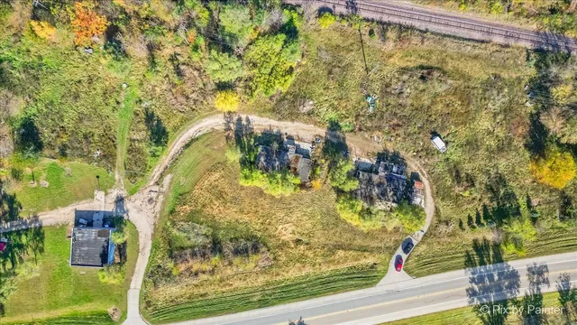 a view of a chairs and table in the backyard