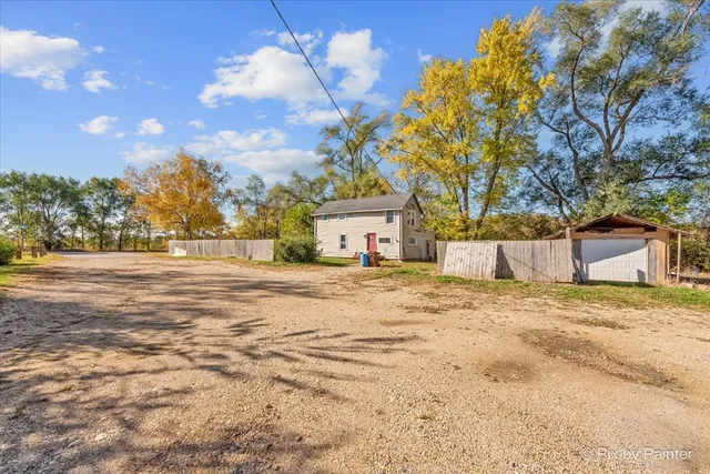 a view of a backyard of the house