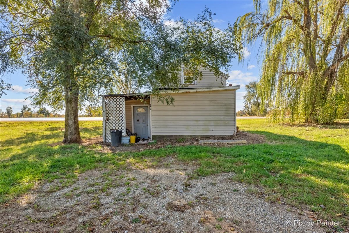 9130 Highway 20 Garden Prairie, IL 61038 - Photo 30 of 31 a view of a backyard with large trees