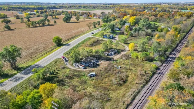 an aerial view of residential houses with outdoor space