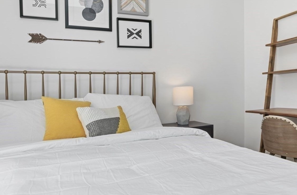 43 Wordsworth Street, Unit 1 Boston, MA 02128 - Photo 14 of 19 a bedroom with a bed and lamp