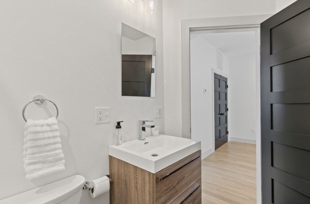 43 Wordsworth Street, Unit 1 Boston, MA 02128 - Photo 16 of 19 a bathroom with a sink a toilet and shower