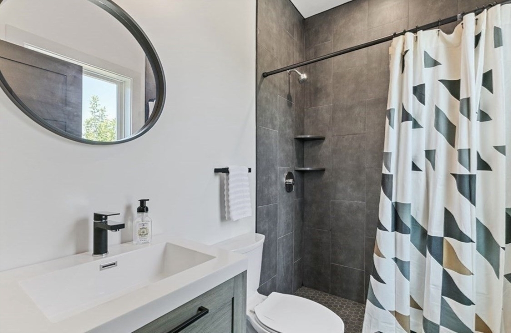 43 Wordsworth Street, Unit 1 Boston, MA 02128 - Photo 18 of 19 a bathroom with a sink toilet and shower