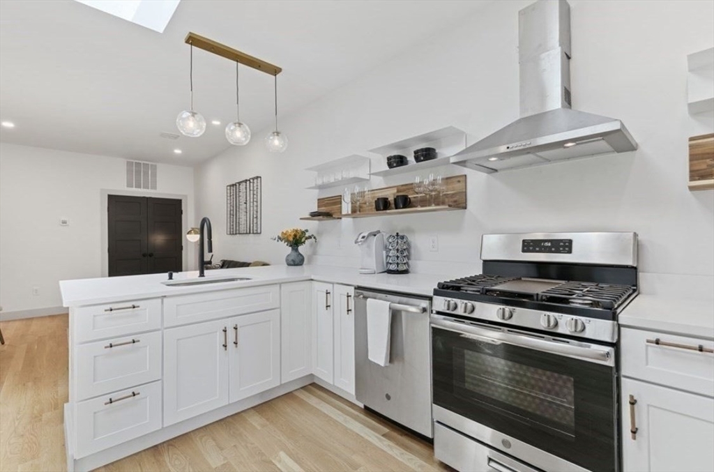 43 Wordsworth Street, Unit 1 Boston, MA 02128 - Photo 6 of 19 a kitchen with cabinets appliances and a sink