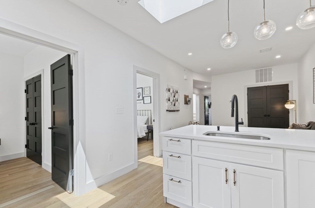 43 Wordsworth Street, Unit 1 Boston, MA 02128 - Photo 8 of 19 a bathroom with a sink a large mirror and a shower