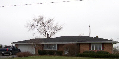 1757 Ipsen Road Belvidere, IL 61008 - Photo 1 of 6 a view of a house with a yard and potted plants