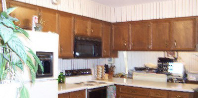 1757 Ipsen Road Belvidere, IL 61008 - Photo 3 of 6 a kitchen with a sink a microwave and cabinets
