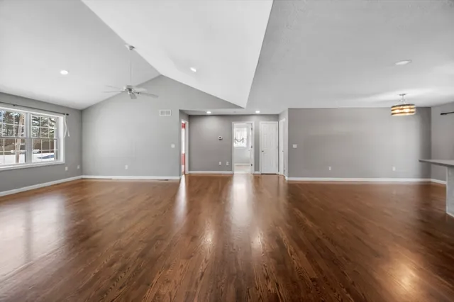 a view of a livingroom with wooden floor