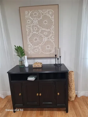 a flower vase with on top of it