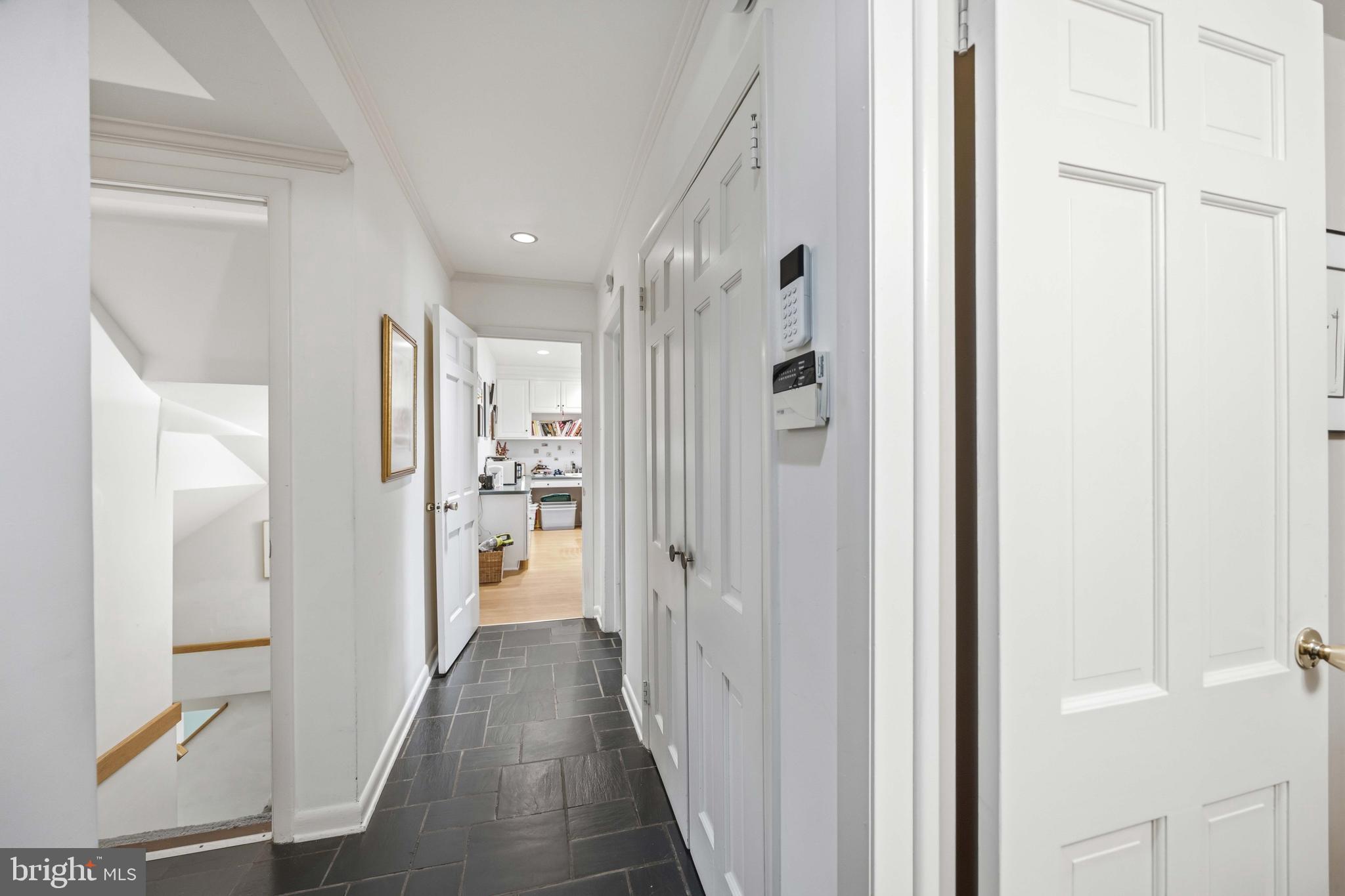 330 Bent Road Wyncote, PA 19095 - Photo 19 of 47 a view of a hallway with wooden floor windows and a kitchen