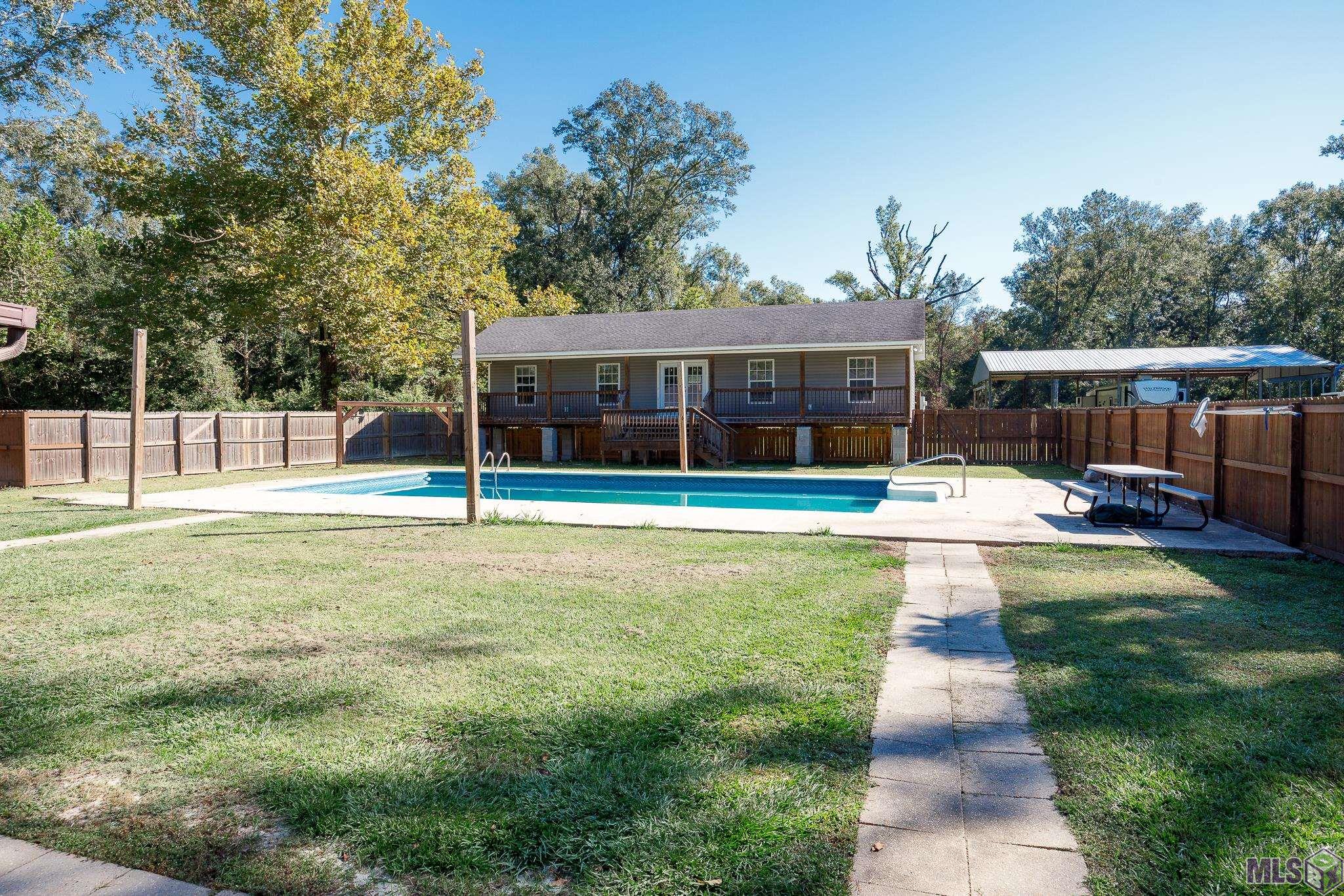 11102 Savoy Road St. Amant, LA 70774 - Photo 22 of 41 Inground Pool with In Law Suite / Pool House
