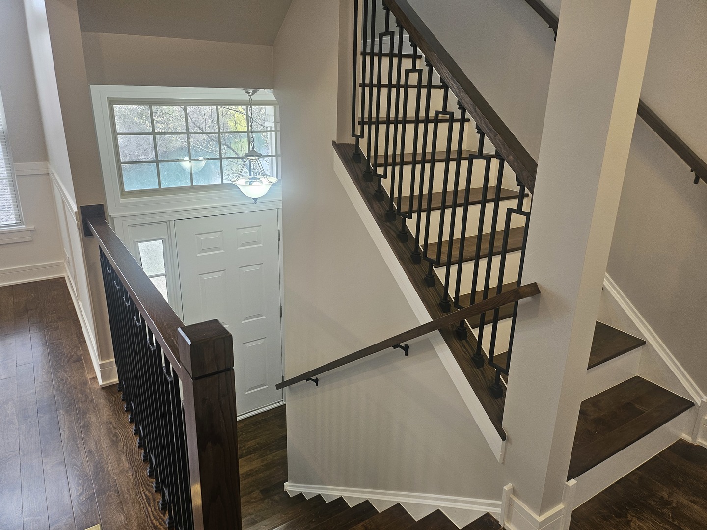 447 Prestwick Lane Wheeling, IL 60090 - Photo 11 of 17 a view of staircase with lots of frames on wall and a window