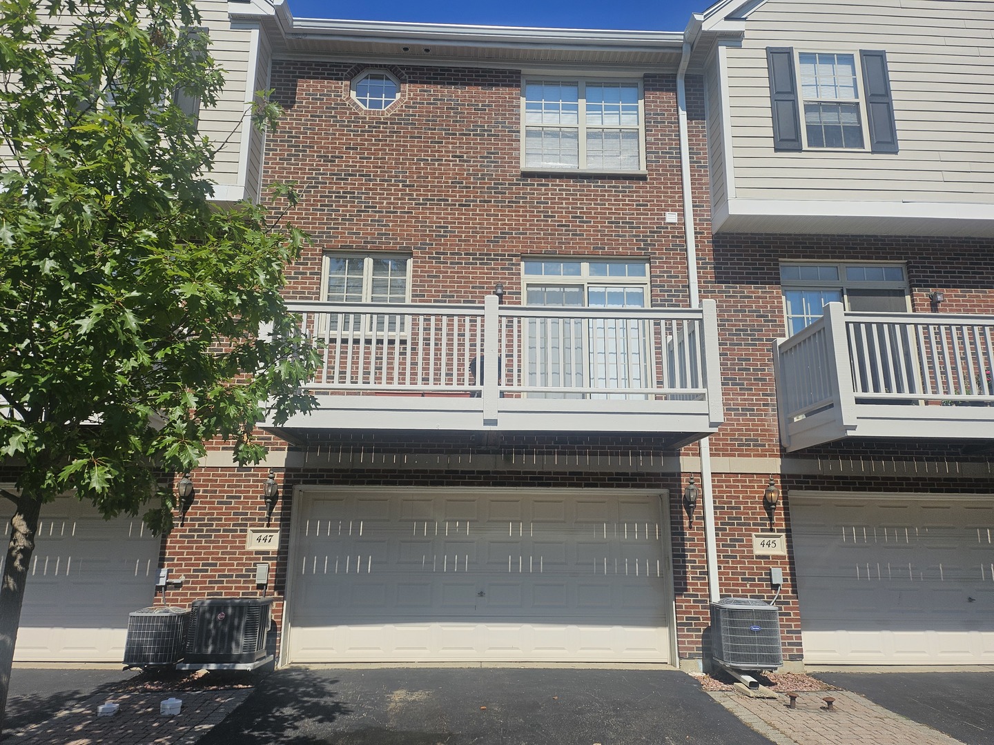 447 Prestwick Lane Wheeling, IL 60090 - Photo 10 of 17 a front view of a house with a garage