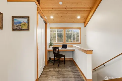 a view of a room with a table and chairs