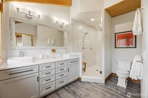 a bathroom with a granite countertop sink mirror and double