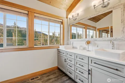 a bathroom with a sink and a window
