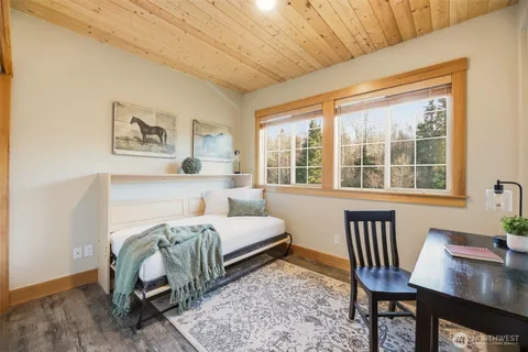a bedroom with furniture and a window